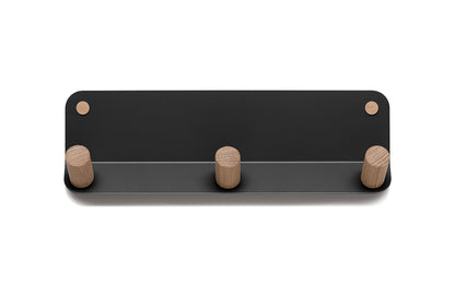 A black Fire Road coat rack with three wooden Plane 3 Wall Hook hooks.