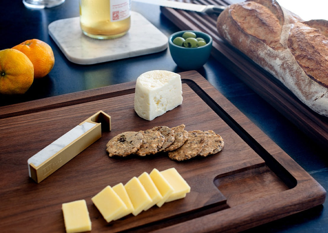 cheese board with marble and brass bottle opener