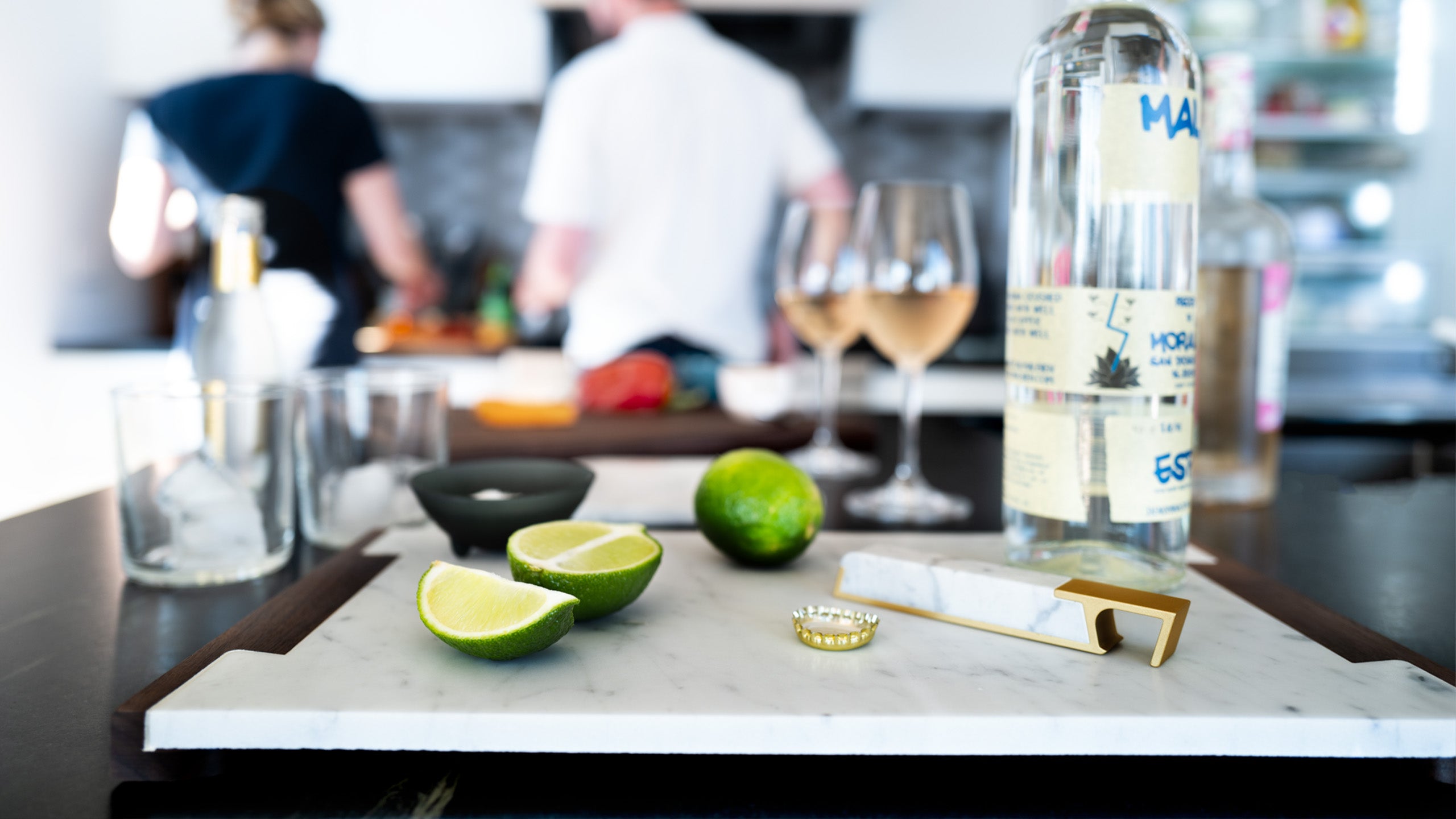 bottle opener and serving tray on counter with drinks