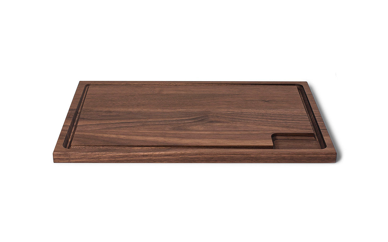 A Fire Road Slope Carving Board with walnut design on a white background.
