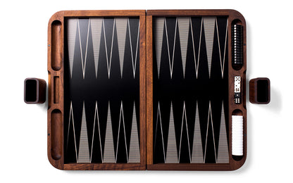 A Skyline Backgammon Set by Fire Road with black and white pieces.