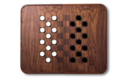 A Skyline Backgammon Set by Fire Road with black dots on it.