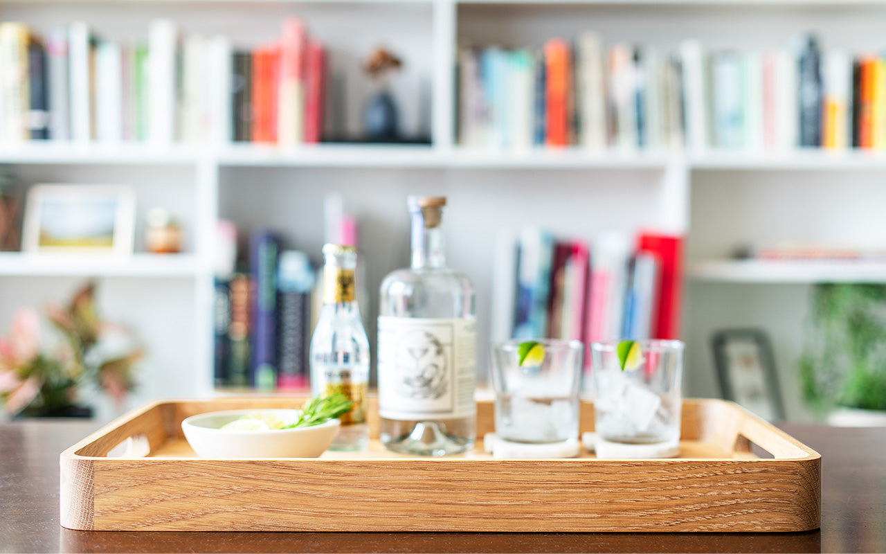 clutch dinner tray with gin and tonic cocktails
