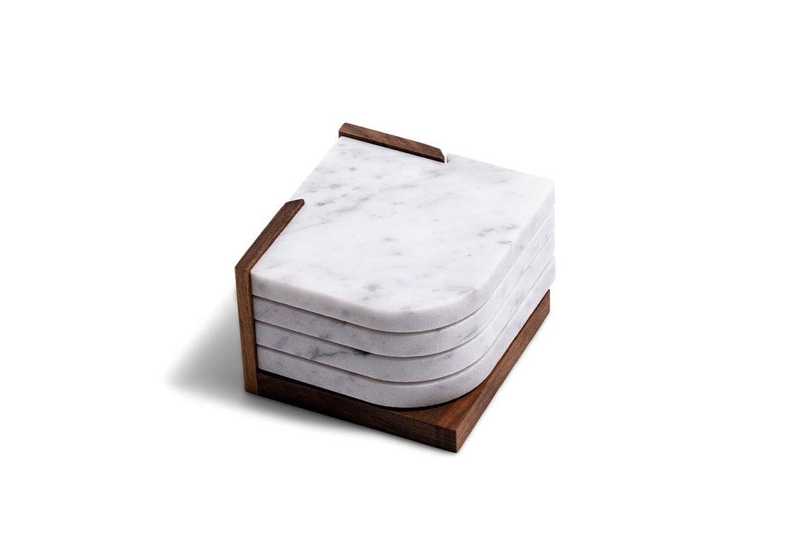 A Fire Road white marble coaster stacked on a wooden block showcasing craftsmanship.