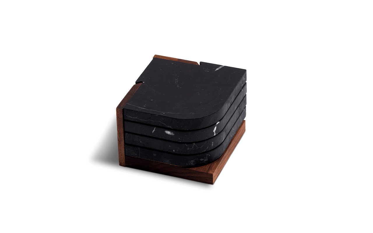 nero marquina marble coasters on walnut stand