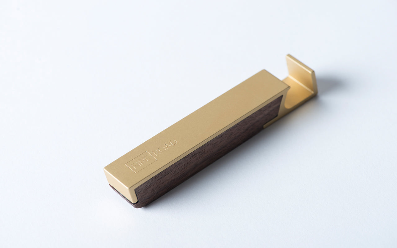 A Fire Road Profile Bottle Opener on a white surface.