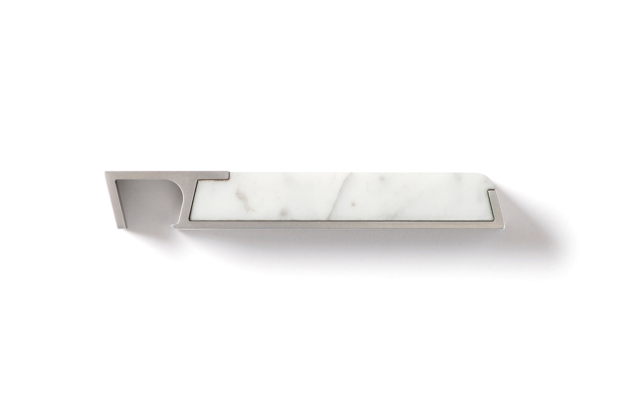 A white Profile Bottle Opener holder with an artful Fire Road experience on a white surface.