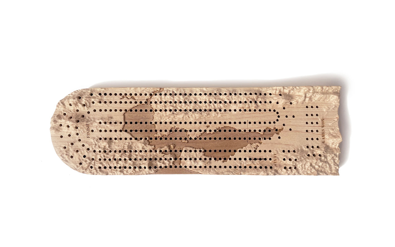 A Terrain Cribbage Board by Fire Road on a white surface.