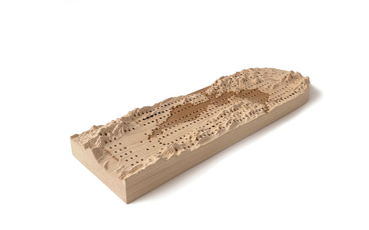 A Fire Road Terrain Cribbage Board with a map on it.