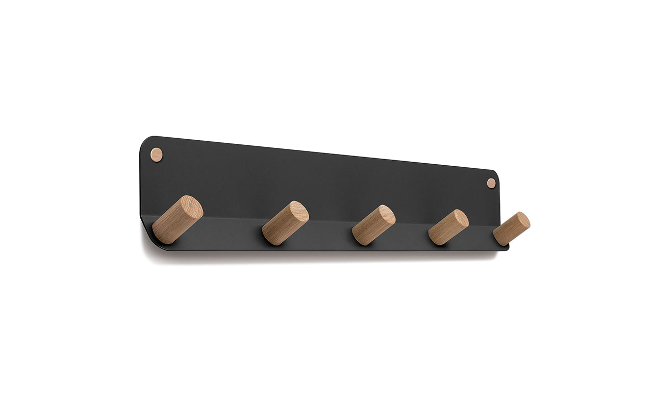 A Fire Road wall-mounted storage with wooden hooks, the Plane 5 Wall Hook.