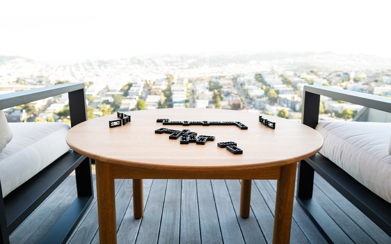 playing dominos on table with view of san francisco