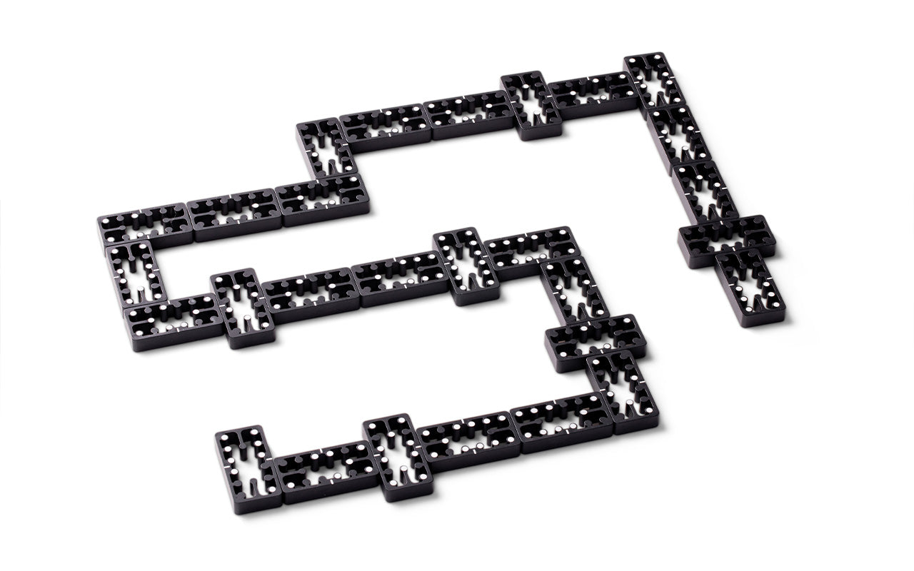game of dominos with black aluminum tiles