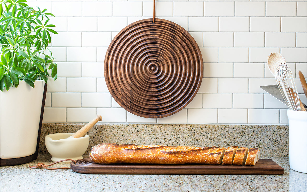 round bread board hanging in kitchen